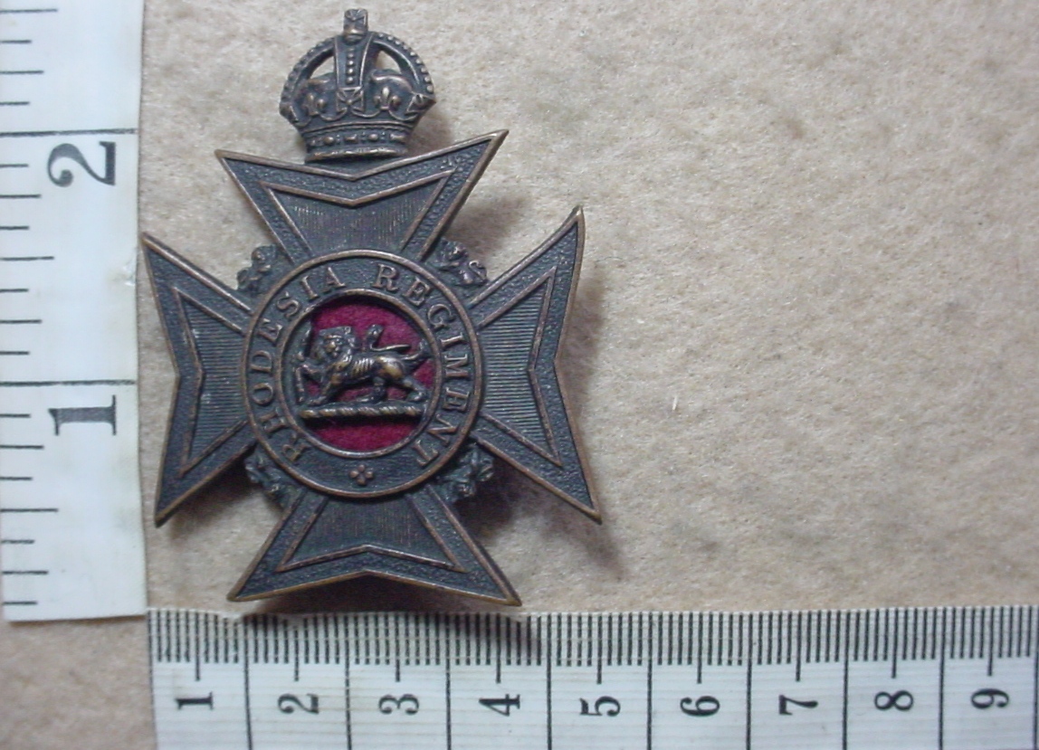 10719-2 Rhodesia Regiment helmet badge, large size with slide (CO2990)