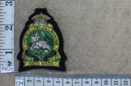 8993-4 British South African Police Association cap badge (R cloth)