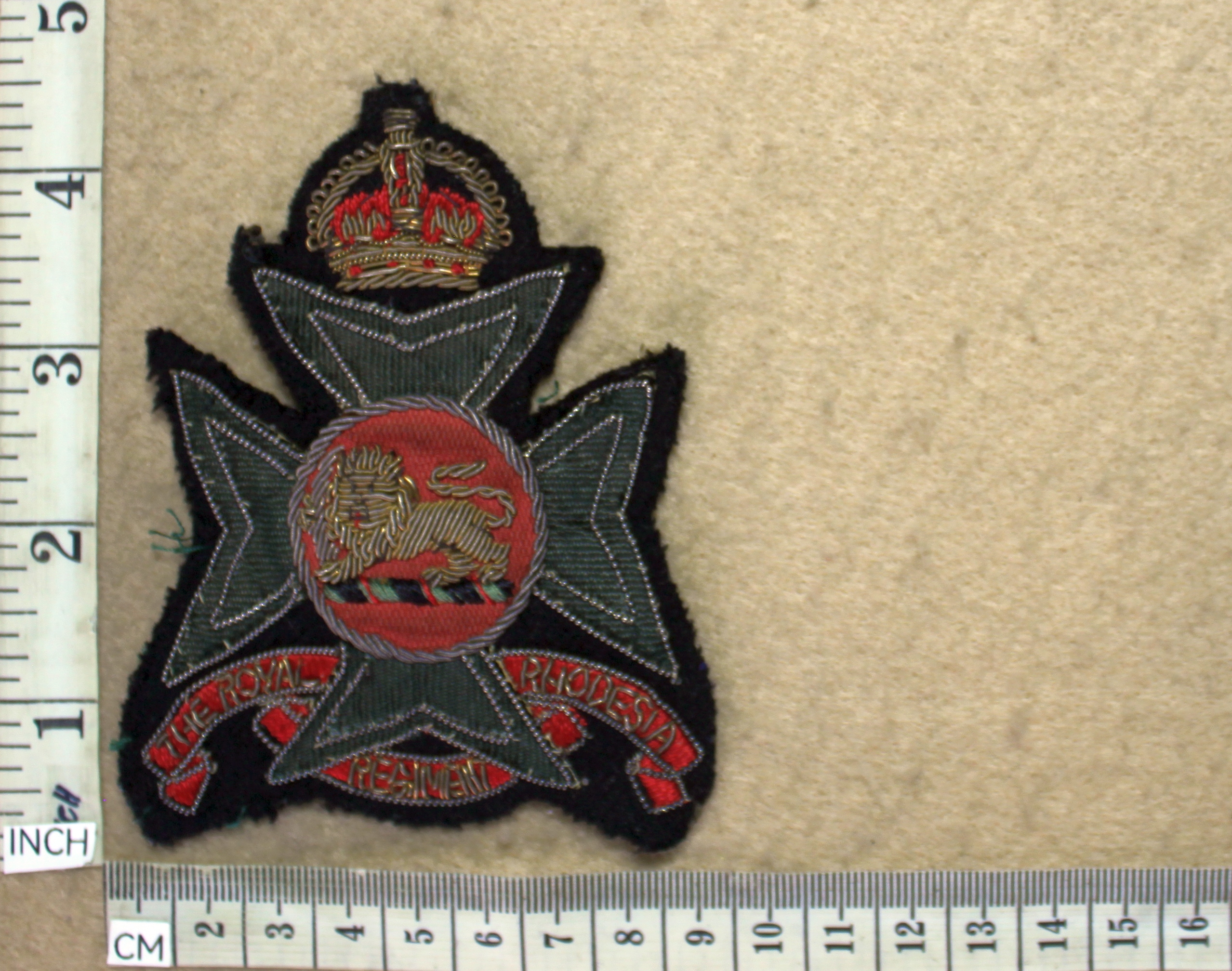 9997-1 Royal Rhodesia Regiment blazer badge, King's Crown (R cloth)